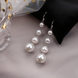Faux ivory pearls drop tassels long earrings