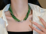 Glass beads crystals necklace and bracelet in emerald green and champagne gold