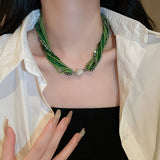 Glass beads crystals necklace and bracelet in emerald green and champagne gold