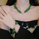 Glass beads crystals necklace and bracelet in emerald green and champagne gold