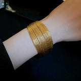 Metal alloy bracelet in gold silver color