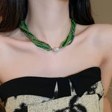 Glass beads crystals necklace and bracelet in emerald green and champagne gold